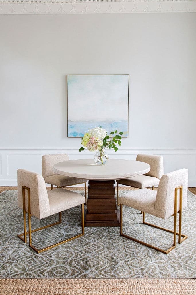 neutral-toned rug under table and chair set