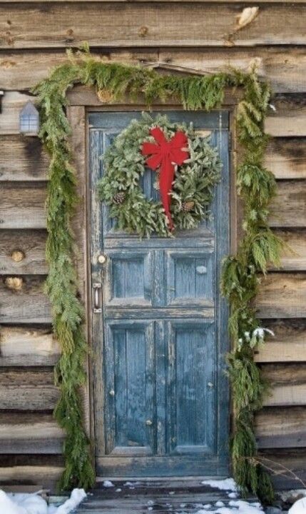 Holiday interior decor ideas: hang garland around the doorframe for a festive touch. Find more home decor ideas with GDC Home.