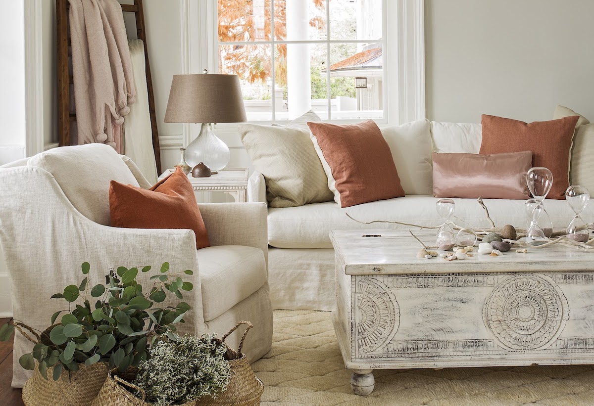 Cozy winter home styling with layered throws, warm lighting, and seasonal décor at GDC Home furniture store in Charleston, SC