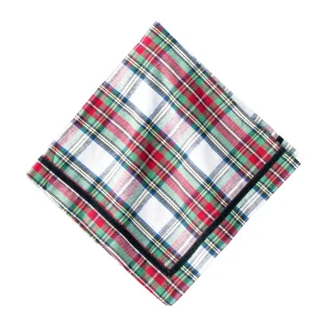 Festive napkins in red, white, and green tartan trimmed with black velvet ribbon