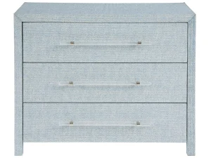 three drawer chest with a blue wallpaper wrapped body and long acrylic pulls