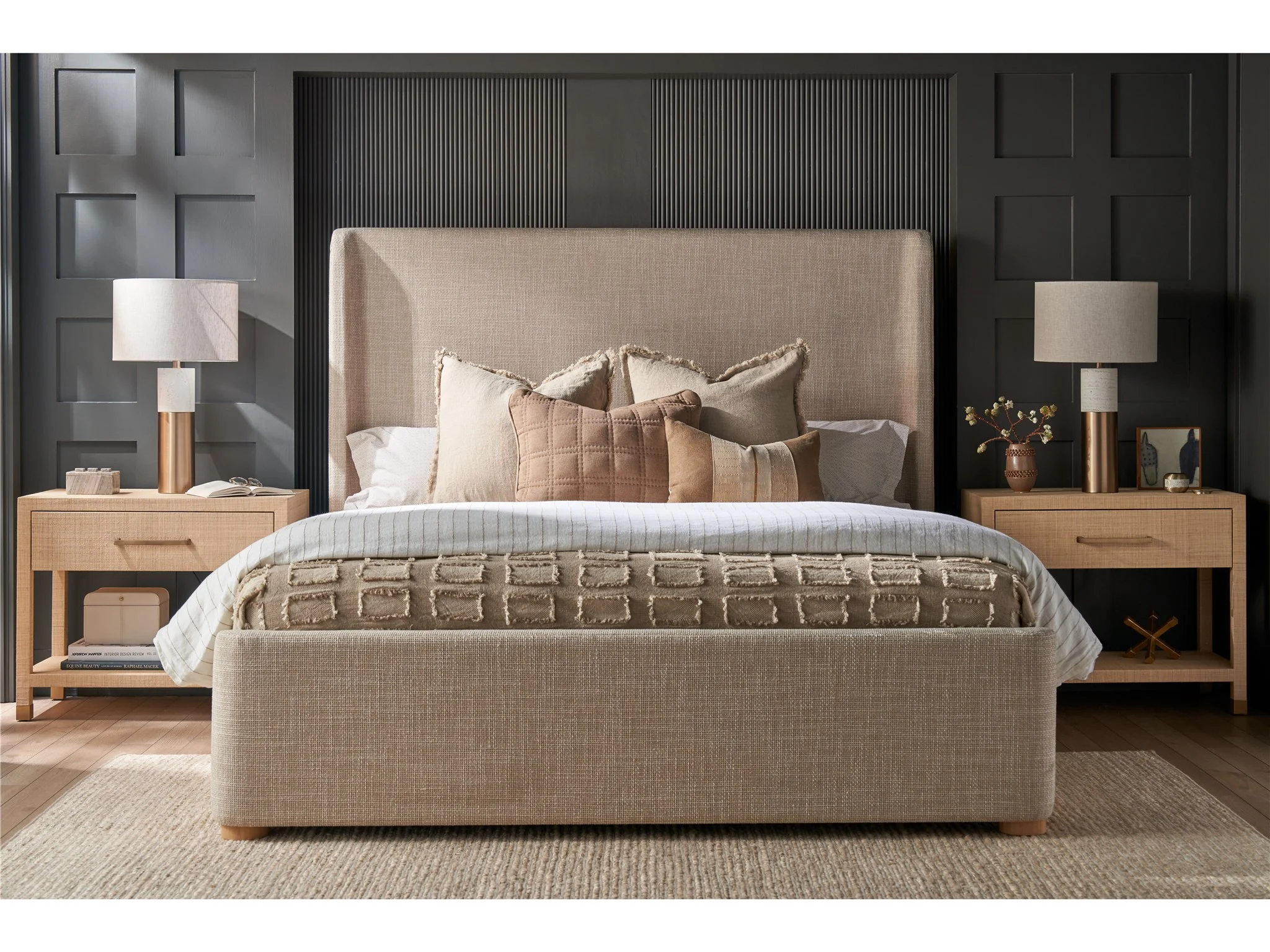lifestyle image of raffia covered nightstands and light brown upholstered bed