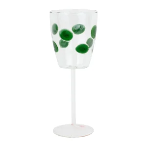 wine glass with green dots