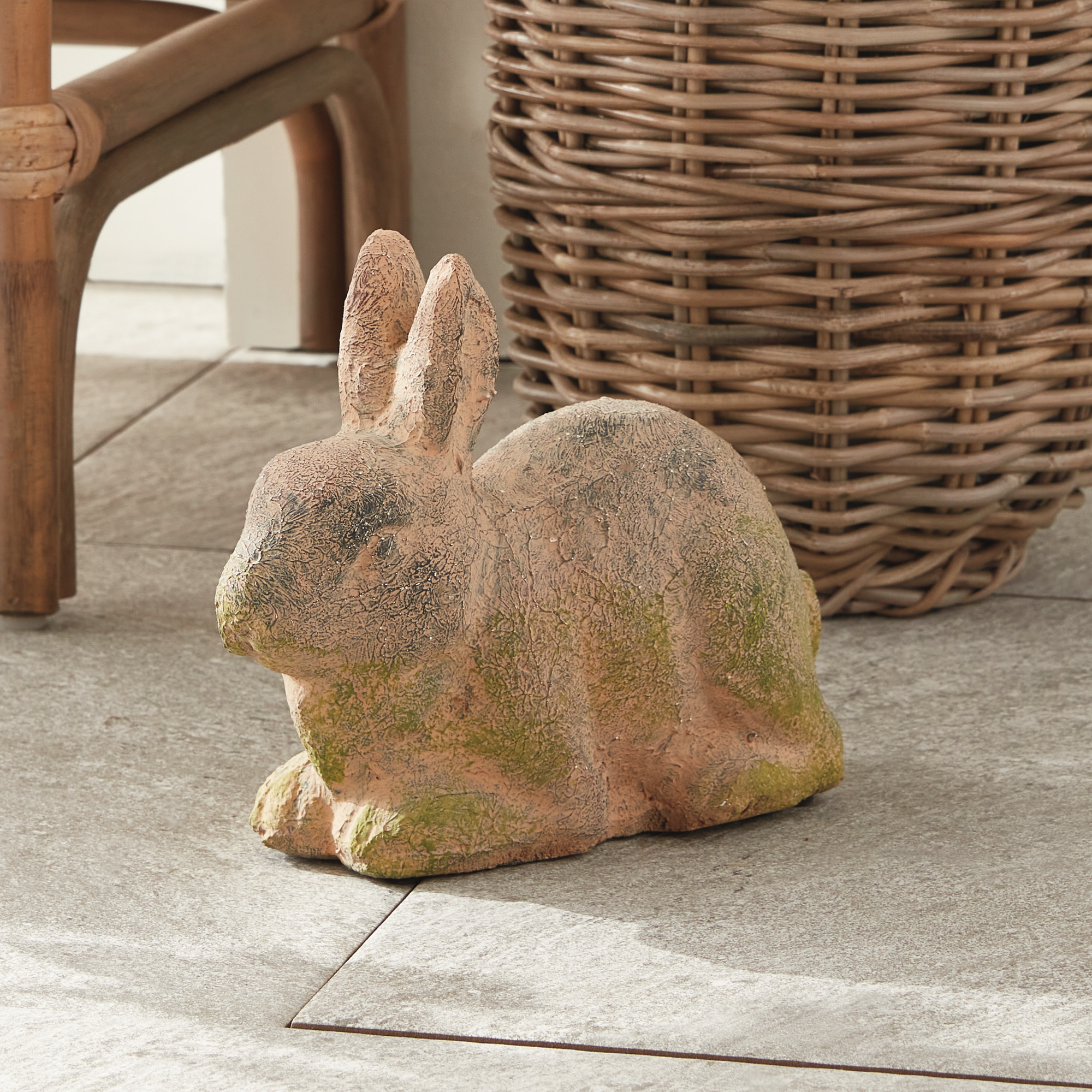 weathered garden rabbit as an outdoor decorative object