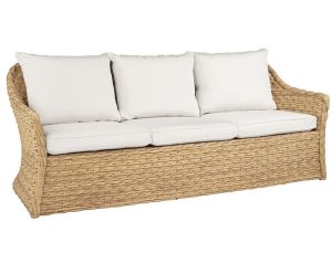 Vero Sofa, outdoor furniture piece with natural woven base and cream pillows