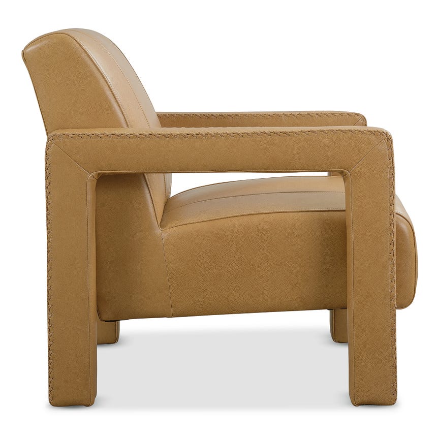 side view of a tan leather upholstered armchair with sturdy arms and detailed stitching.
