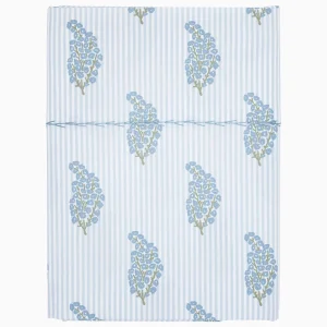 light blue striped sheet with floral sprig pattern, hand stitching detail