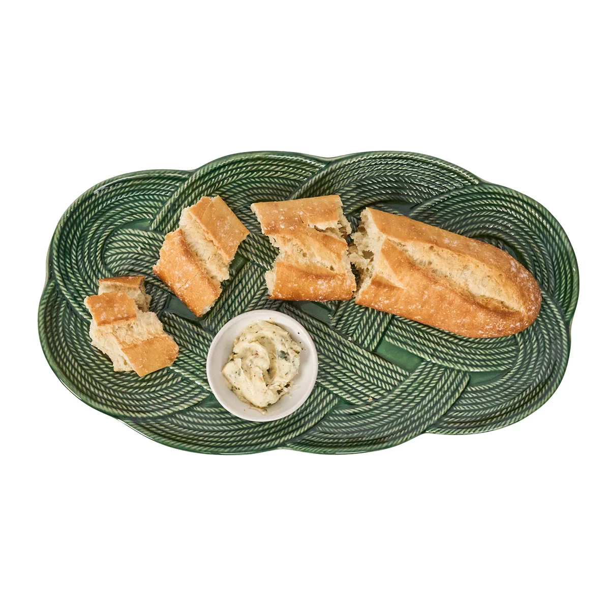 dark green small hostess tray with intricate, interwoven braiding shown with bread and butter