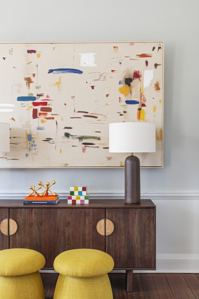 Designed entryway with Mount Pleasant furniture demonstrating the styling of wood furniture for layered spaces.