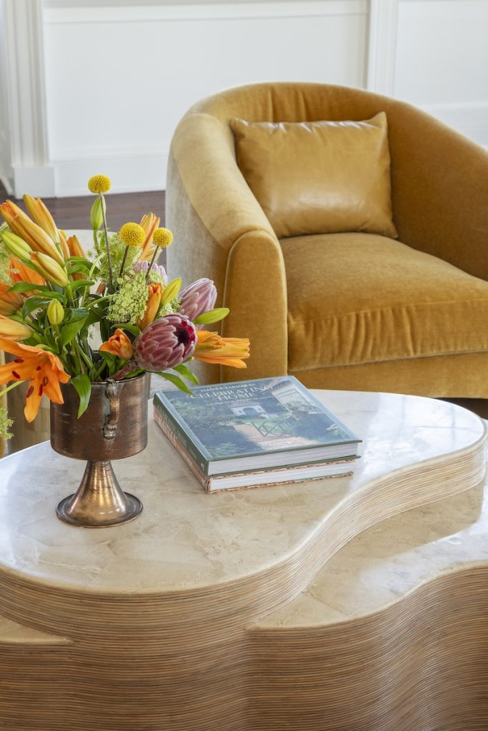 Living room with vibrant color exhibiting how to wok stone accents in your home decor with GDC Mount Pleasant.