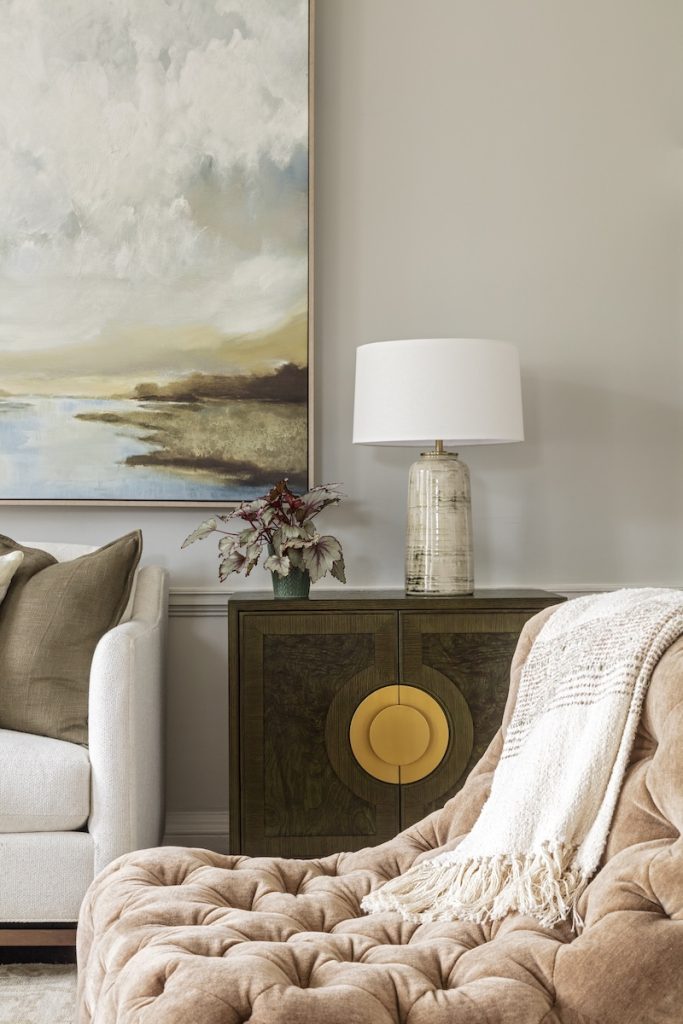 Accessorizing Mount Pleasant homes with stylish wall art, decorative objects, pillows, and blankets.