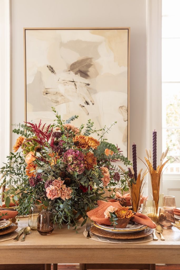 Adding additional height and layers with centerpieces can elevate your holiday table. 