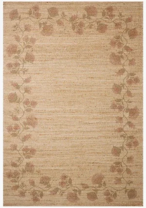 flatweave rug borded by pink hued florals