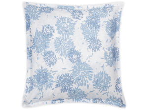 The chrysanthemum sham featuring blue floral print on a white background, modeled on a square pillow
