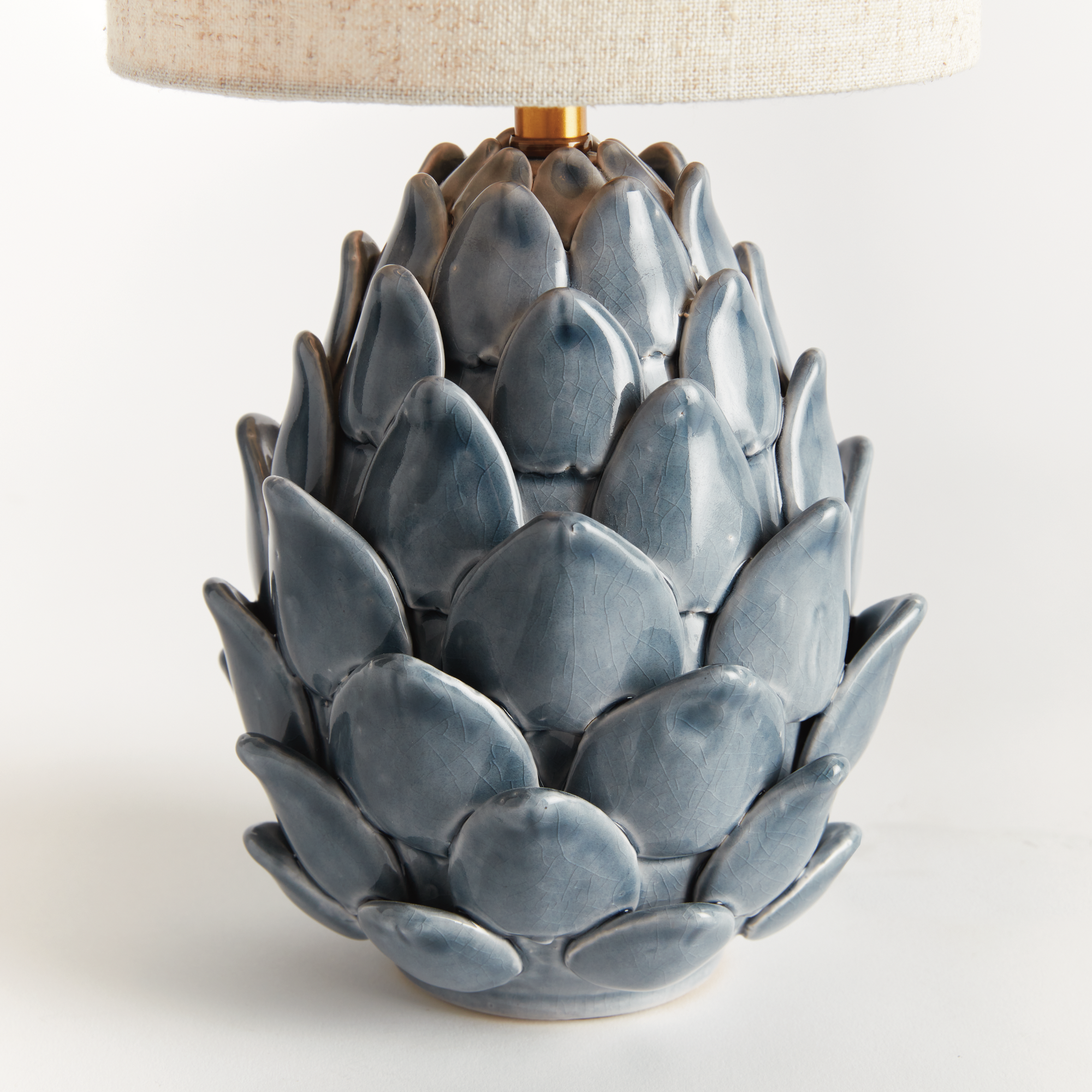 detail of the blue finish on an artichoke inspired lamp