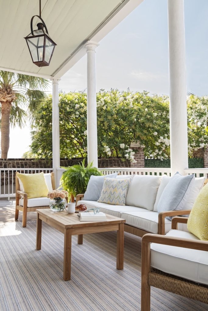 Charleston patio styled with deep seating outdoor furniture for extra comfort in a pastel coastal color palette, from Charleston home furniture store GDC Home