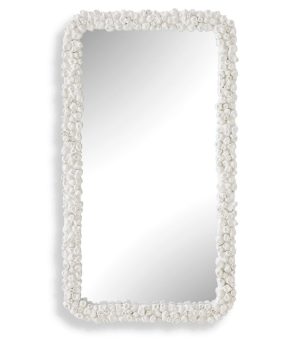Clusters of faux barnacles in a warm white frame a rectangular mirror that can be hung horizontal or vertical.