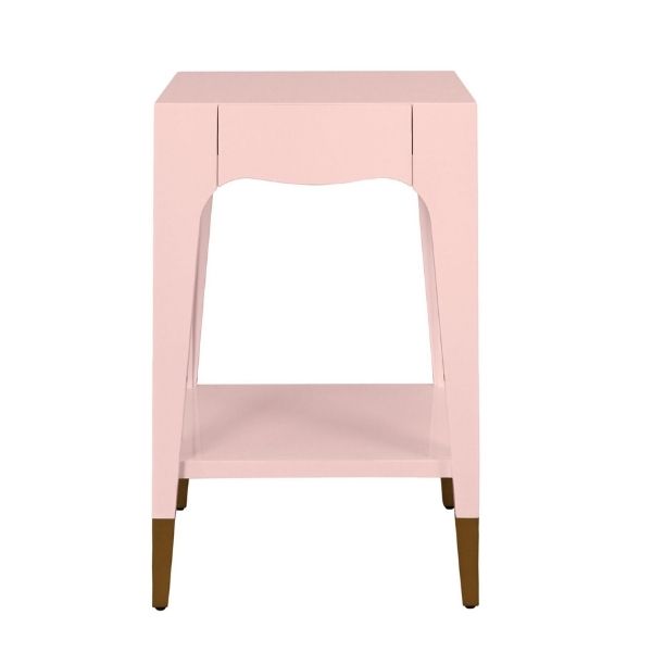 light pink side table with a single drawer, an open shelf, and antique brass foot caps