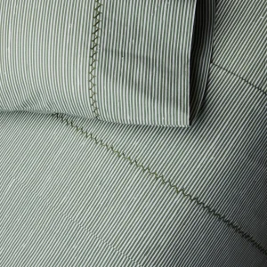 detail of block print stripe bedding in dark sage, sheets and pillowcases, hand stitched detail