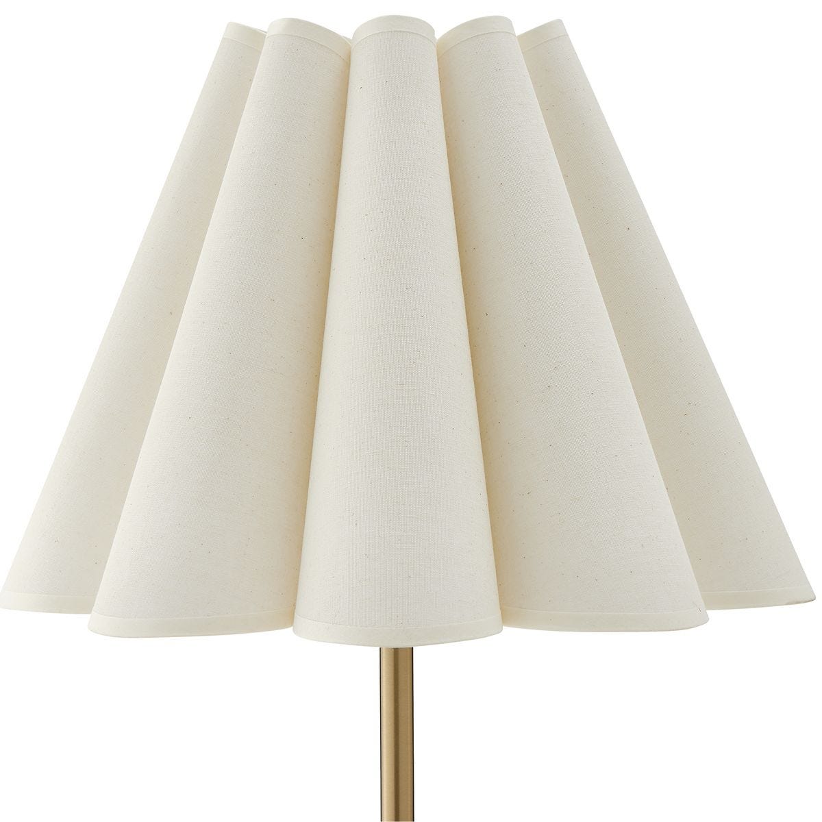 detail of brass lamp with white scalloped shade