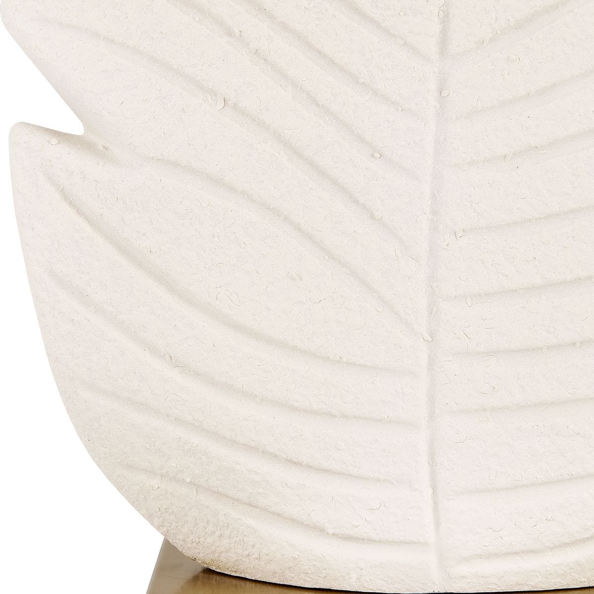 detail of textured palm leaf motif on table lamp