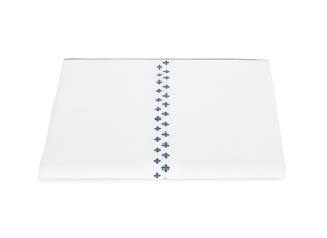 white duvet cover with indigo embroidered Moroccan tilework design