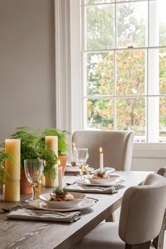 Luxury upholstered dining chairs arranged in a coastal dining room styled with GDC's Charleston home furniture