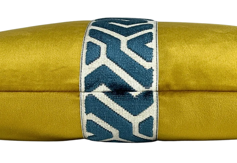 ochre velvet lumbar pillow with a navy geometric embroidered center band