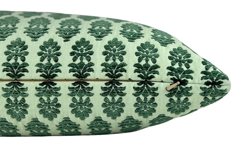 detail of textured block print lumbar pillow in greens