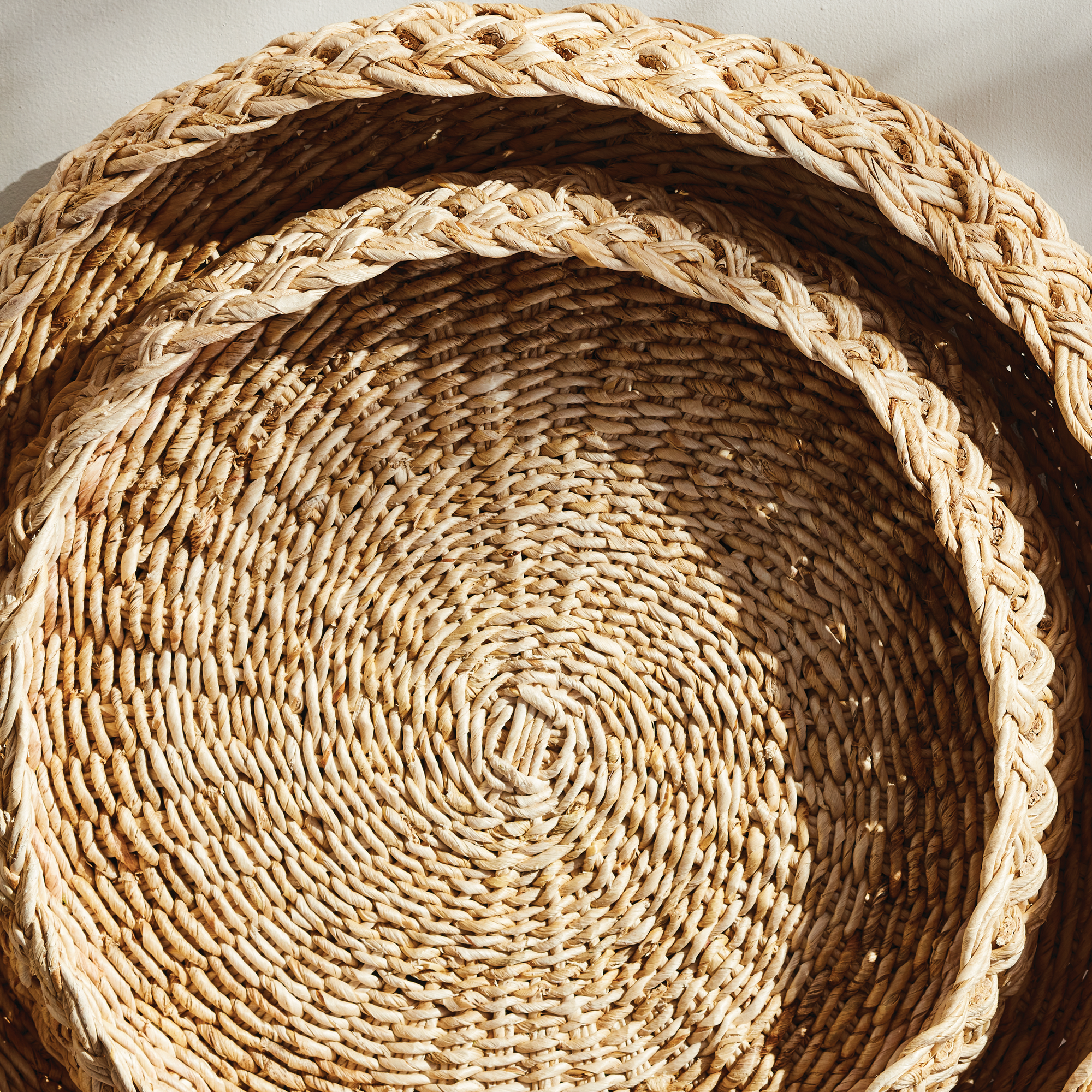 detail of braided abaca round tray set