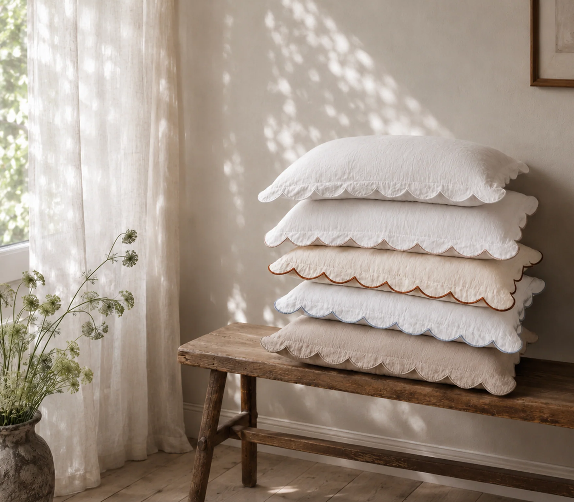 stack of scalloped linen decorative pillows