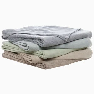 stack of folded herringbone cotton blankets