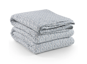 folded blue block print quilt, dotted wave