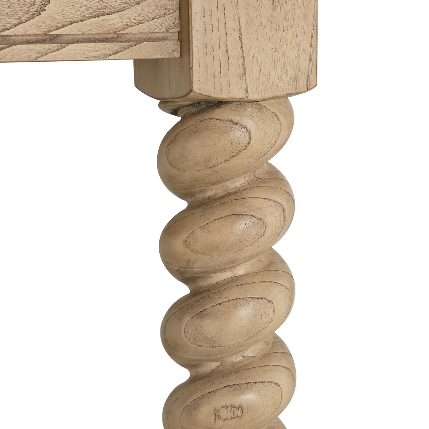 detaill of 84" dining table with turned legs in light blonde hue