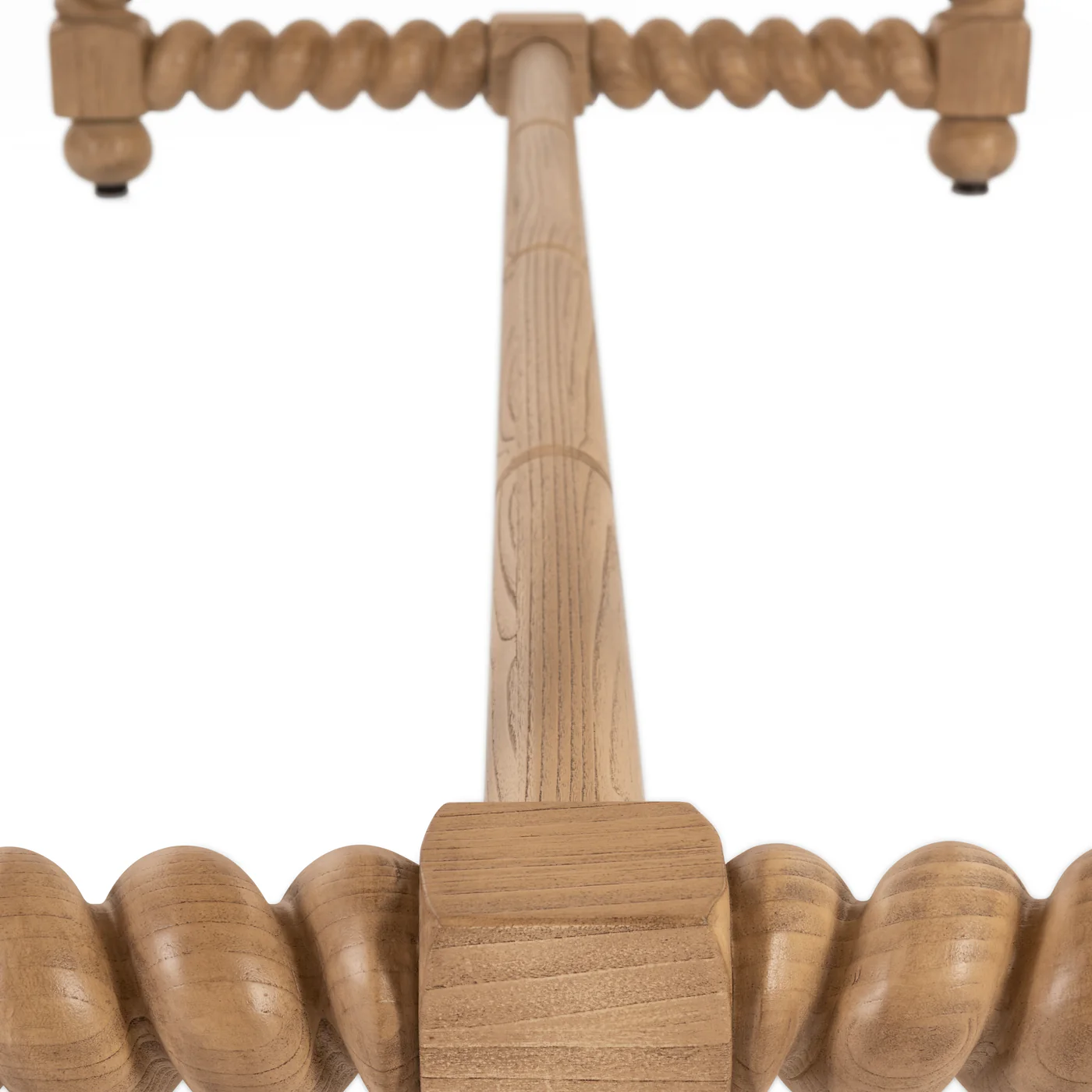 detail of the bottom of 84" dining table with turned legs in light blonde hue