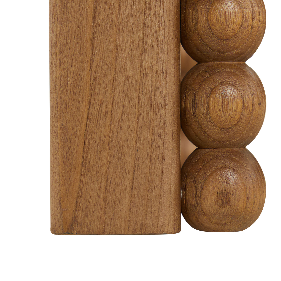 detail of bobbin trim console table in light wood finish