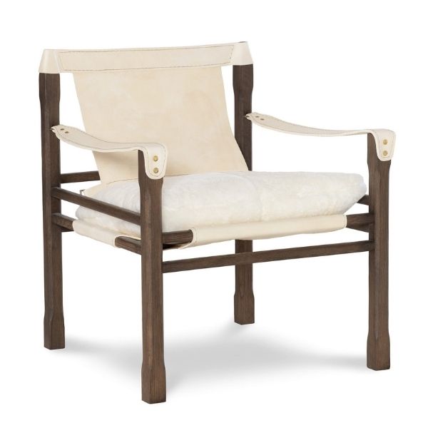 A modern-style accent chair with a dark wood frame and sling accents