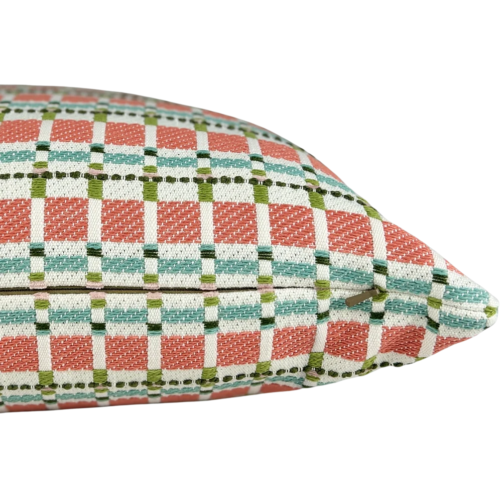 detail of coral, aqua and green plaid throw pillow with woven windowpane pattern