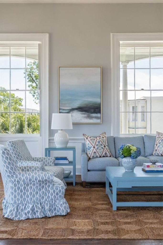 Two patterned accent chairs styled in a living room with coastal home decor and furniture from the best furniture stores Charleston has to offer, GDC.