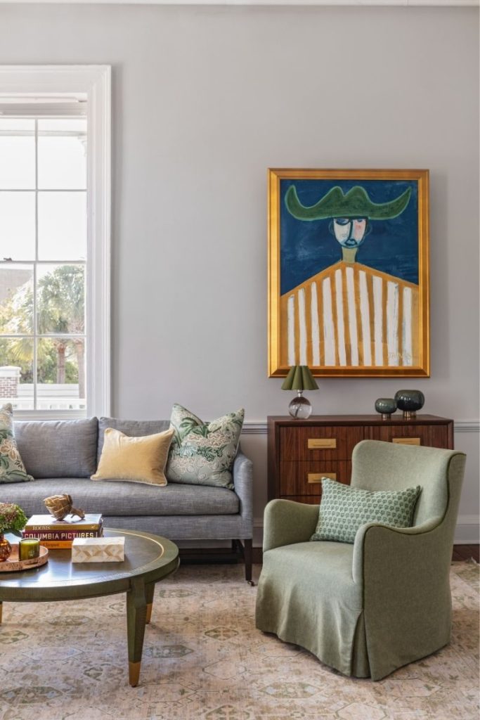 A green accent chair with a skirt styled by GDC Home furniture Mt Pleasant SC