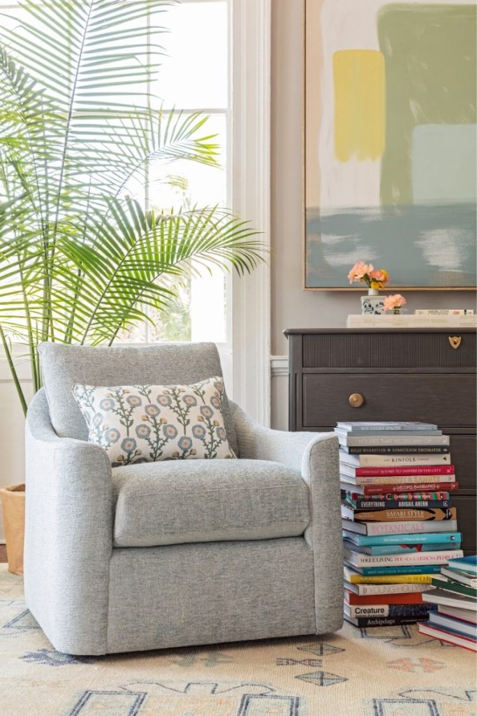 A reading nook styled accent chair in a bedroom by the best furniture stores Charleston has to offer: GDC Home