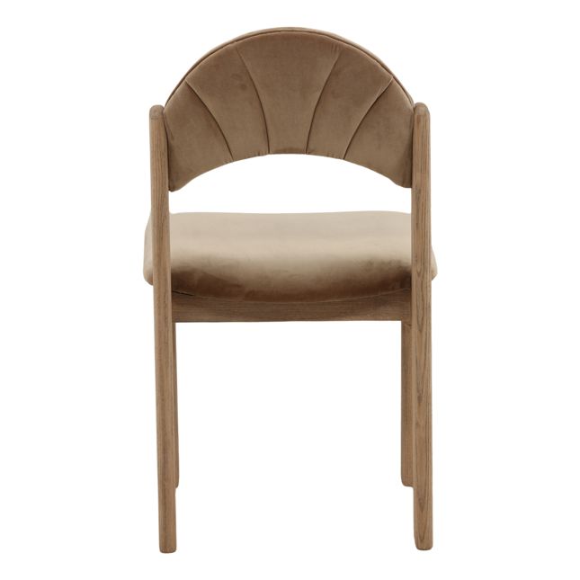 back view of a dining chair with a wood frame, light brown velvet seat and back, and curved scalloped backrest