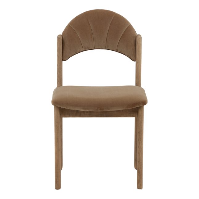 front view of a dining chair with a wood frame, light brown velvet seat and back, and curved scalloped backrest