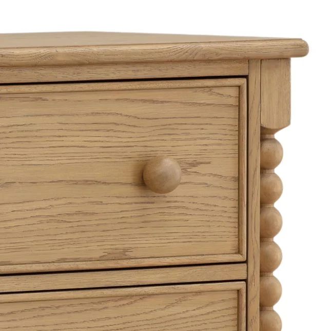 detail bobbin style dresser with round knobs in a natural finish