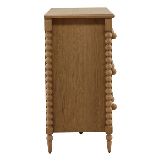 side view of a bobbin style dresser with six drawers in a natural finish