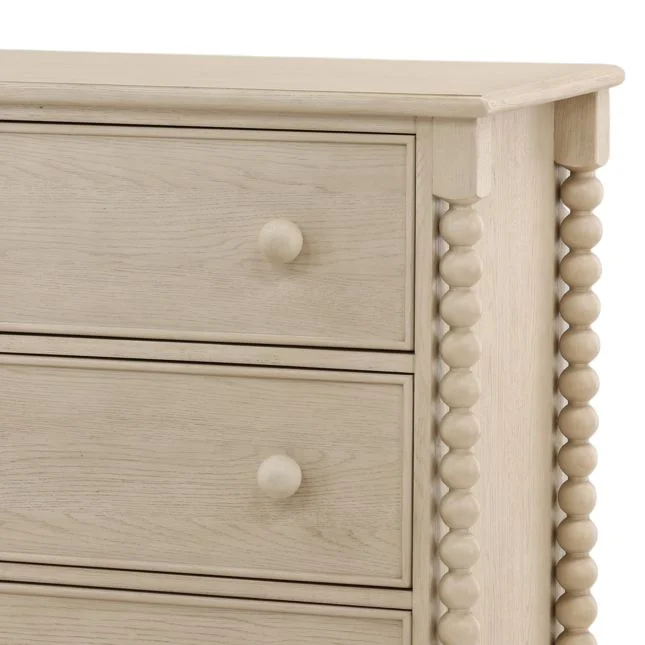 detail of bobbin style dresser with round knobs in a whitewash finish