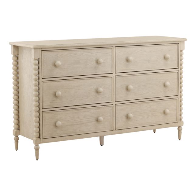bobbin style dresser with six drawers in a whitewash finish