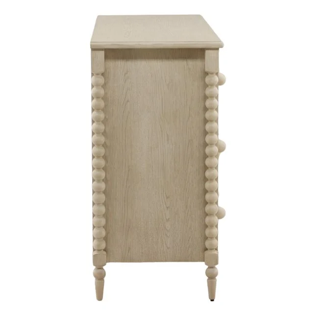 side view of bobbin style dresser in whitewash finish