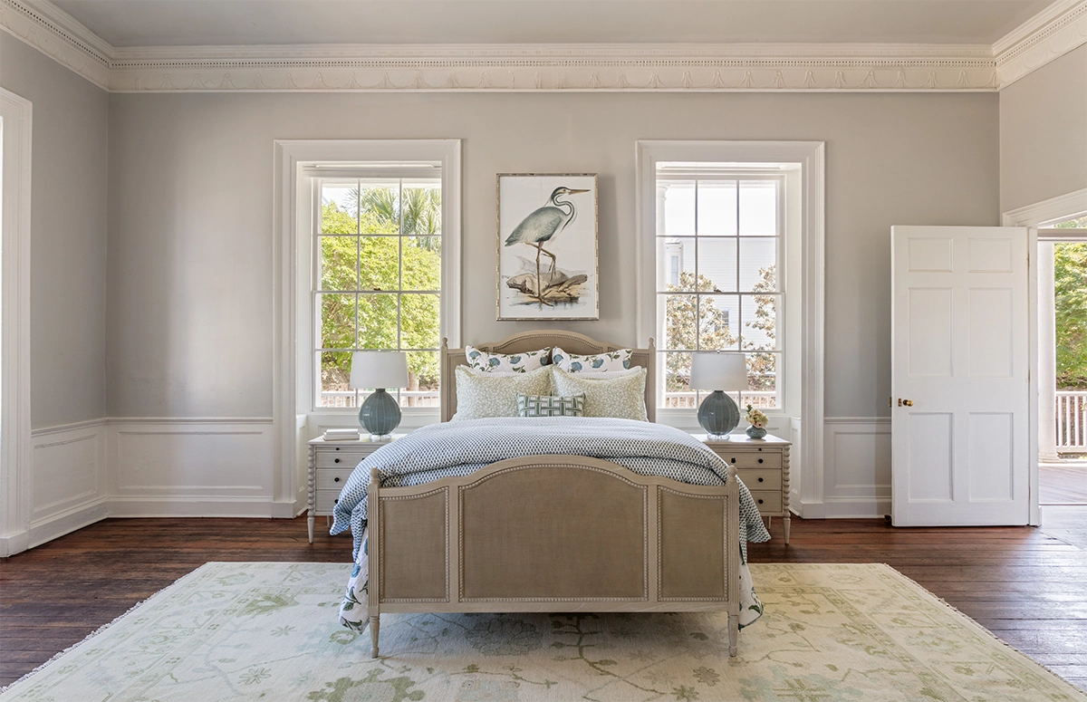 2026 bedroom design trends including upholstered headboards, oversized art, mixed pattern bedding, and textured bedding seen in Charleston SC