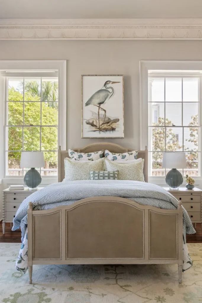 Oversized art hanging over the headboard of a coastal bedroom, featuring Lowcountry art from our Charleston home decor stores